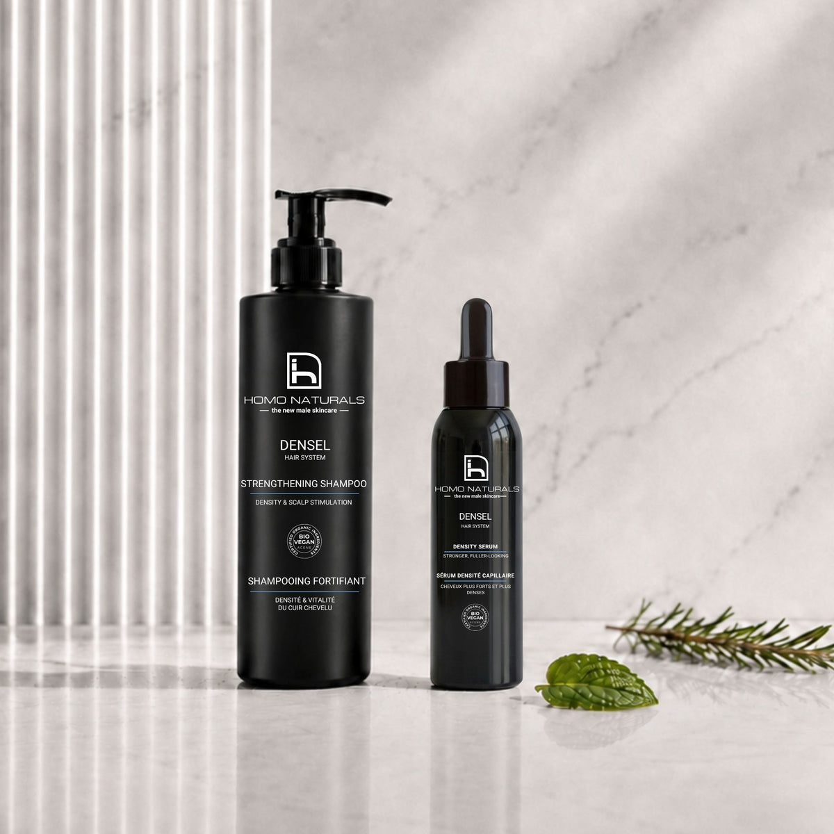 Foto del tratamiento anticaída capilar para hombre de la marca Homo Naturals. Se compone de una rutina de cuidado capilar en 2 pasos: champú reforzante y serum para aumentar la densidad capilar. Tratamiento natural con certificación ecológica y vegana. 